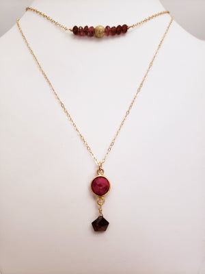 Delicate Bar Necklace Features Faceted Garnet Surrounded By a Gold-Filled Sparkle Ball To Form a Slight Curved Bar On Gold-Filled Chain Opens the Heart To Love.