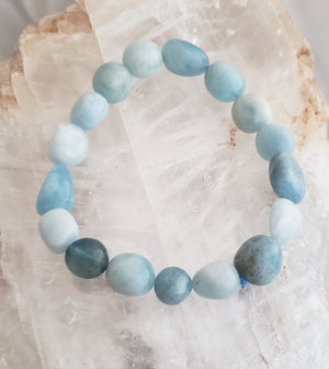 Aquamarine Beaded Bracelet on Elastic Cord Reduces Stress by Calming the Mind.