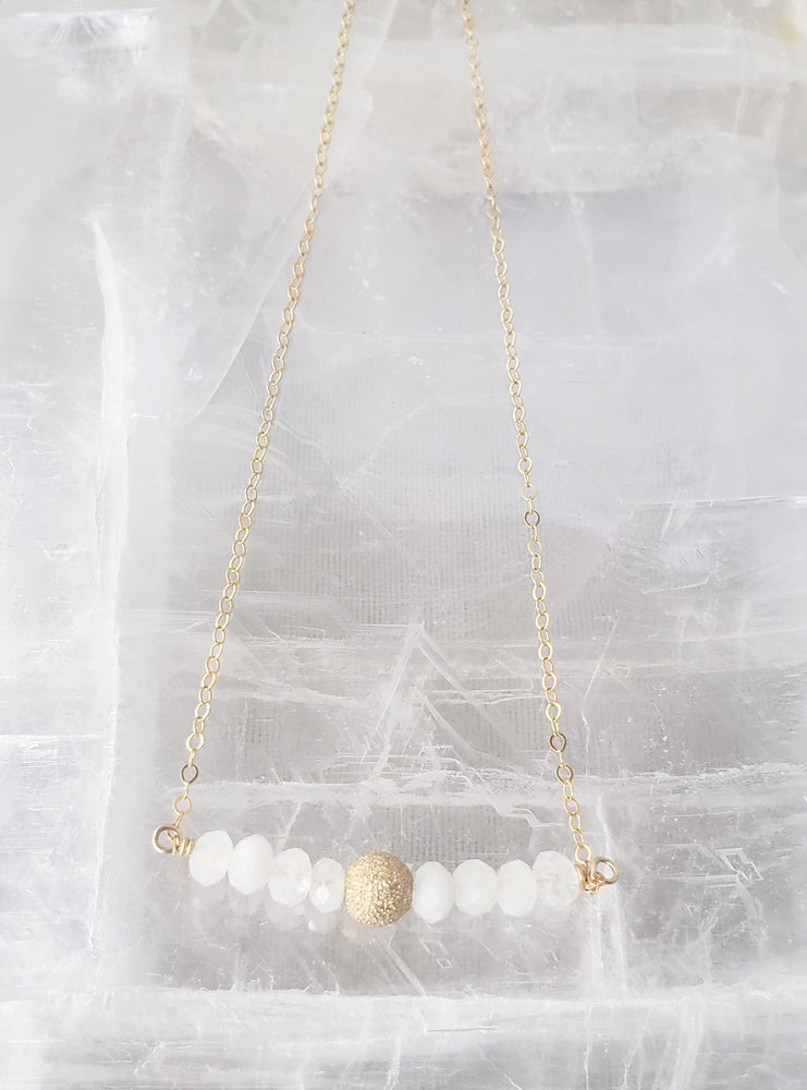 Delicate Bar Necklace Features Faceted Moonstone Surrounded By a Gold-Filled Sparkle Ball To Form On Gold-Filled Chain Enhances Feminine Energy.