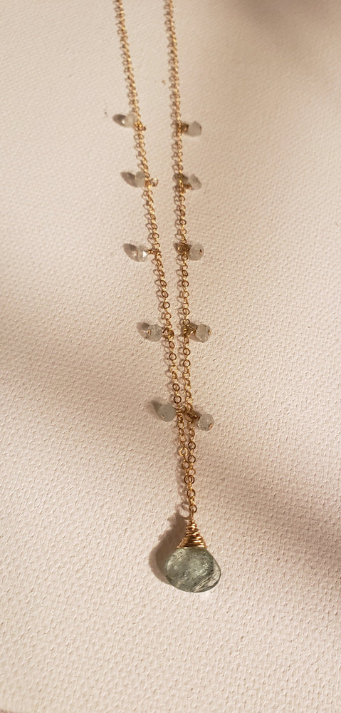 Faceted Aquamarine Pendant Necklace with Tiny Aquamarine Gemstones Dangling Around the Neck