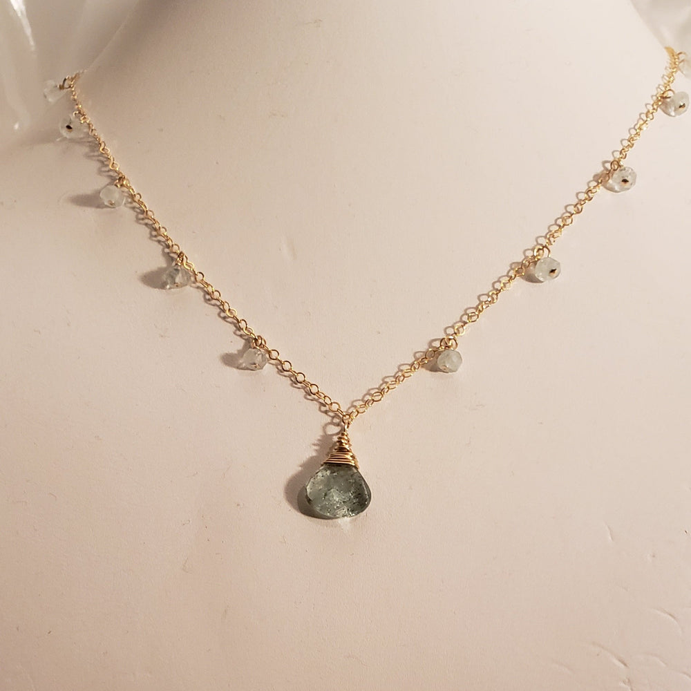 Faceted Aquamarine Pendant Necklace with Tiny Aquamarine Gemstones Dangling Around the Neck