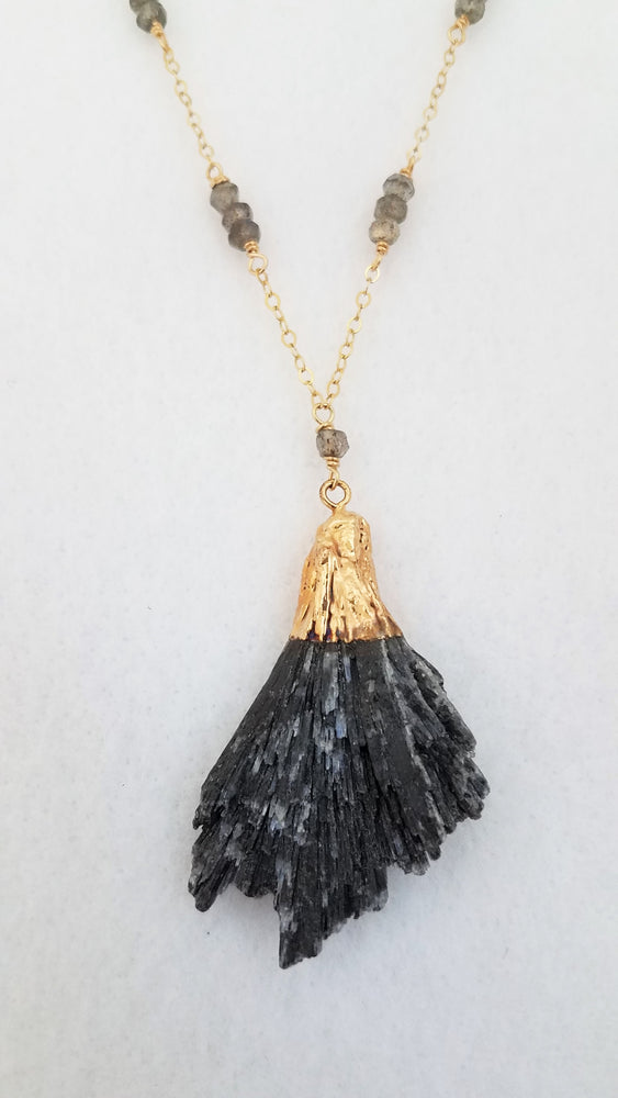 A Trio of Faceted Labradorite Gemstones Are Wire Wrapped Onto Gold-Filled Chain With an Organic Shaped Black Kyanite Pendant.