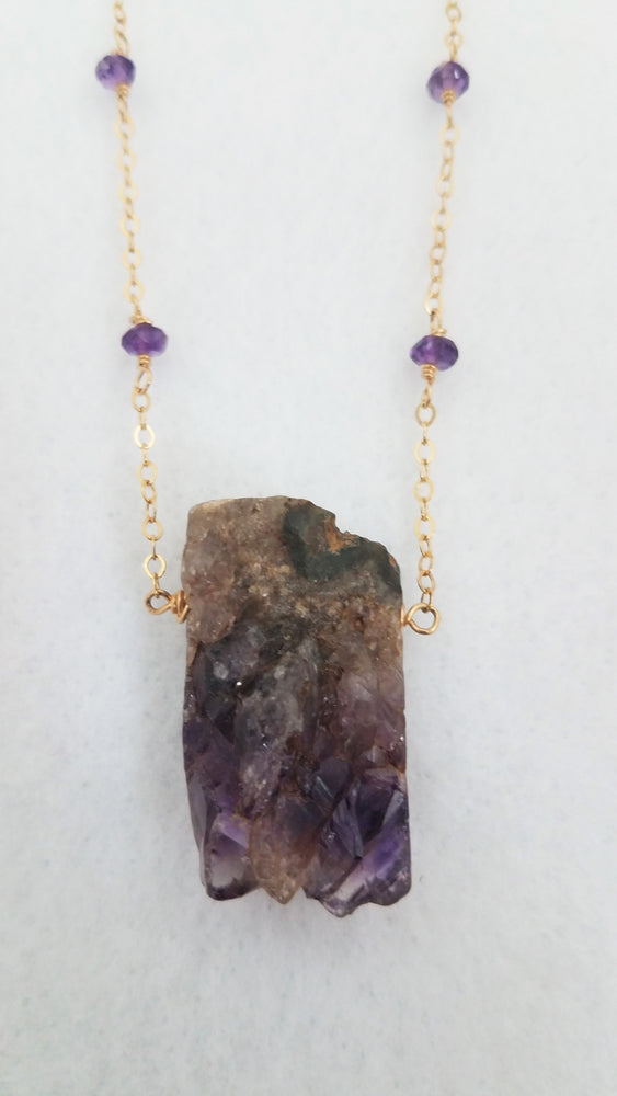Raw Amethyst Nugget Pendant is Surrounded by Faceted Amethyst roundel on Gold-Filled Chain.