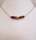 Delicate Bar Necklace Features Faceted Garnet Surrounded By a Gold-Filled Sparkle Ball To Form a Slight Curved Bar On Gold-Filled Chain Opens the Heart To Love.