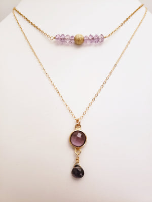 Delicate Pendant Necklace Features a Faceted Bezel Set Amethyst With a Faceted Iolite Tear Drop on a Fine Gold-Filled Chain.