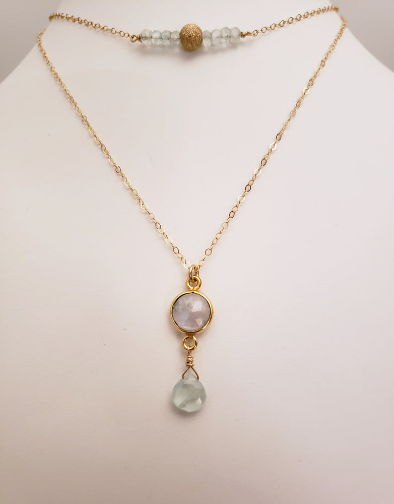 Delicate Bar Necklace Features Faceted Aquamarine Surrounded By a Gold Filled Sparkle Ball to Form a Curved Bar On Gold-Filled Chain Promote Calmness.