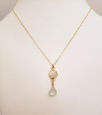 Delicate Pendant Necklace Features a Faceted Bezel Set Moonstone With a Faceted Tear Drop on a Fine Gold-Filled Chain.