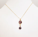 Delicate Pendant Necklace Features a Faceted Bezel Set Amethyst With a Faceted Iolite Tear Drop on a Fine Gold-Filled Chain.