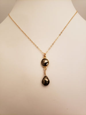 Delicate Pendant Necklace Features a Faceted Bezel Set Pyrite With a Faceted Tear Drop on a Fine Gold Chain.