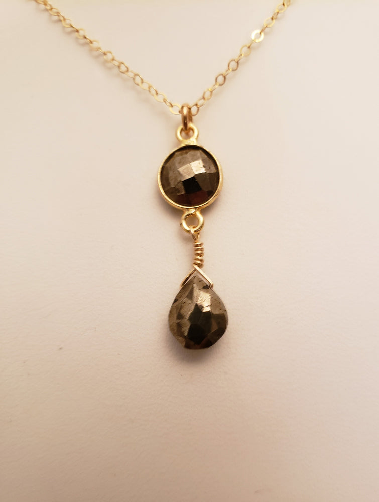 Delicate Pendant Necklace Features a Faceted Bezel Set Pyrite With a Faceted Tear Drop on a Fine Gold Chain.
