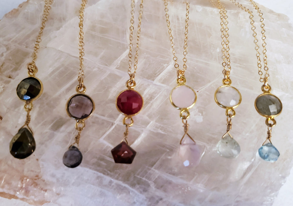 Delicate Pendant Necklace Features a Faceted Bezel Set Ruby With a Faceted Garnet Tear Drop on a Fine Gold-Filled Chain.