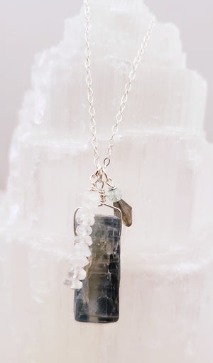 Kyanite, Moonstone and Aquamarine Trio of Stones Form a Charm Style Necklace on Sterling Silver Chain.