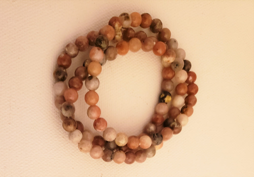 Rhodonite 8MM Beaded Bracelet on Elastic Cord Balances Emotions, Nurtures Love and Encourages Compassion.