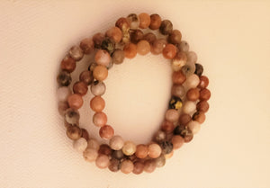 Rhodonite 6MM Beaded Bracelet on Elastic Cord Balances Emotions, Nurtures Love and Encourages Compassion.