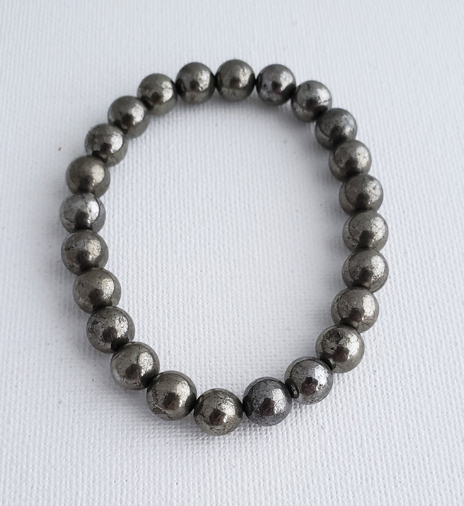 Pyrite 8 mm Beaded Bracelet on Elastic Cord is the Gemstone of Abundance.